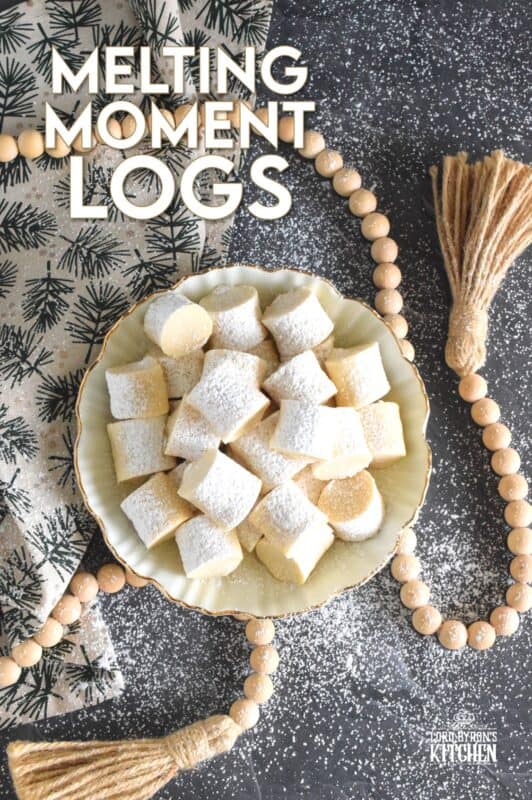 These light and fluffy cookies are prepared with cornstarch, which is what gives them that melt-in-your-mouth texture.  Simply flavoured with a bit of vanilla extract, confectioner's sugar, and butter, Melting Moment Logs are easy to prepare and must be featured in your holiday baking this year! #melting #meltingmoments #cookies #holiday #baking