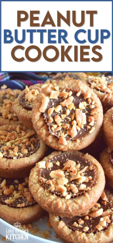 Thumbprint-style cookies are very popular at Christmastime, so why not over-stuff them with a full-sized Peanut Butter Cup? These cookies are so easy to make and are baked in muffin tins! Push in the peanut butter cup and top with chopped peanuts for more texture and flavour! #peanutbutter #reeses #cookies #thumbprint