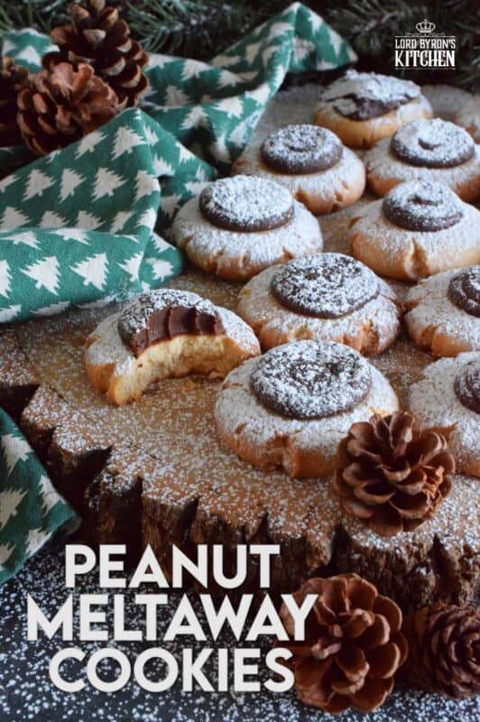 Peanut Meltaway Cookies are a melt-in-your-mouth cookie prepared with peanut butter and topped with a chocolate peanut butter ganache.  Doesn't that sound delicious!?  The base has a shortbread, crumbly-like texture that pairs extraordinarily well with the creaminess of the smooth ganache dollop.  These are simply irresistible! #meltaway #peanutbutter #ganache #cookies