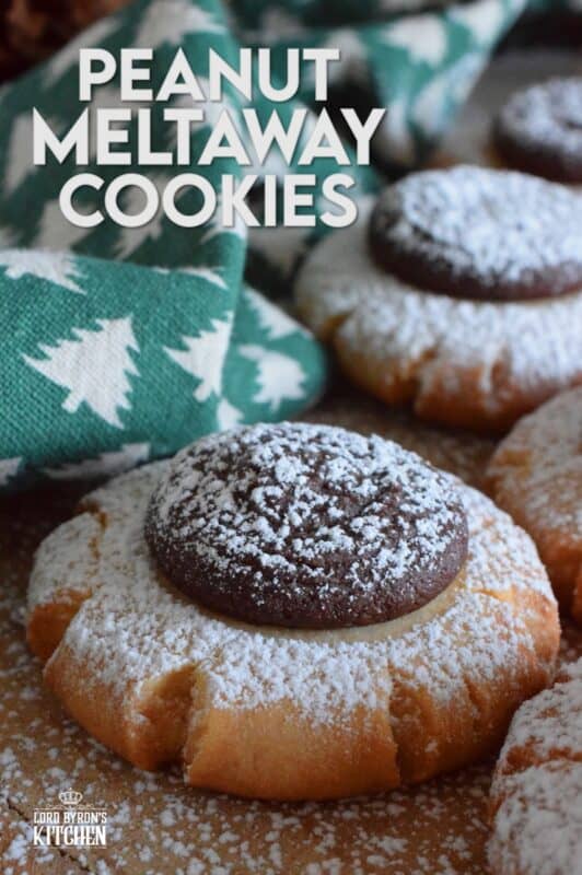 Peanut Meltaway Cookies are a melt-in-your-mouth cookie prepared with peanut butter and topped with a chocolate peanut butter ganache.  Doesn't that sound delicious!?  The base has a shortbread, crumbly-like texture that pairs extraordinarily well with the creaminess of the smooth ganache dollop.  These are simply irresistible! #meltaway #peanutbutter #ganache #cookies
