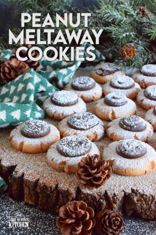 Peanut Meltaway Cookies are a melt-in-your-mouth cookie prepared with peanut butter and topped with a chocolate peanut butter ganache.  Doesn't that sound delicious!?  The base has a shortbread, crumbly-like texture that pairs extraordinarily well with the creaminess of the smooth ganache dollop.  These are simply irresistible! #meltaway #peanutbutter #ganache #cookies
