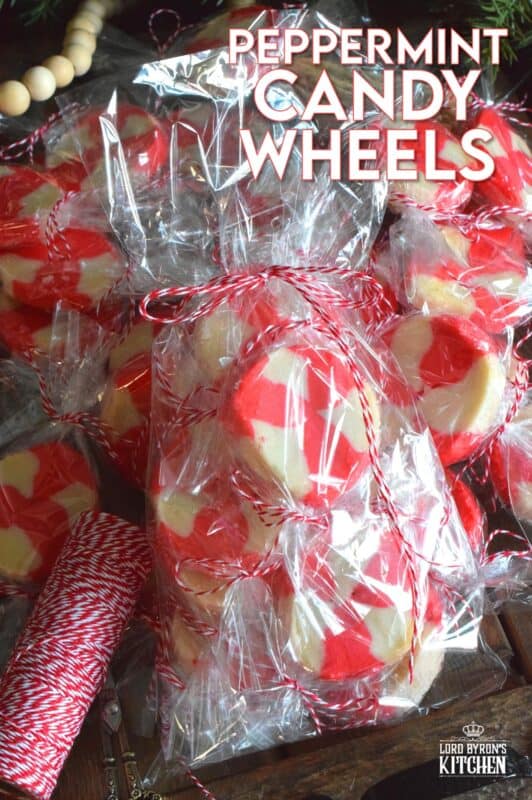 The perfect gift-giving cookie, Peppermint Candy Wheels are individually wrapped in cellophane and tied with a festive string. They may look impressive and maybe even tedious and time consuming, but these cookies really couldn't be easier! And besides, whomever you share these with will certainly appreciate the effort! #peppermint #cookies #candies #redandwhite