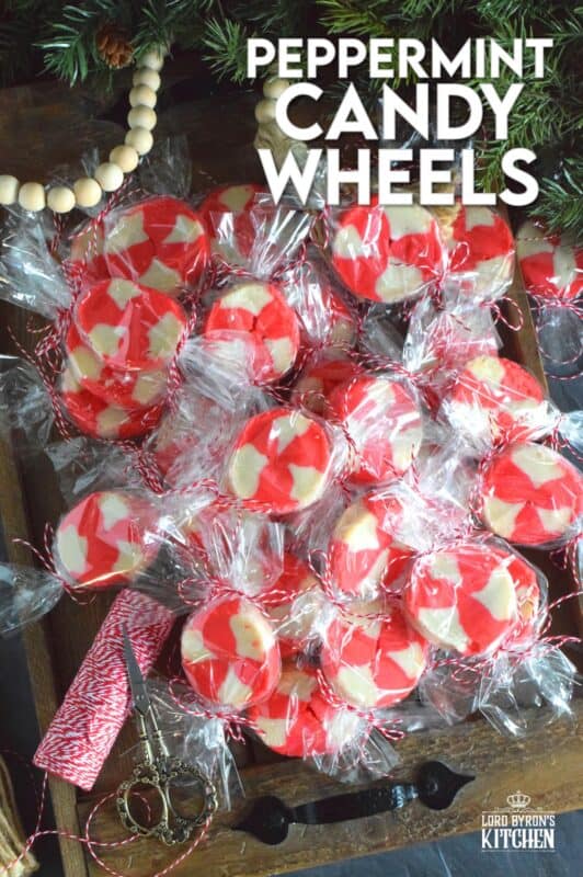 The perfect gift-giving cookie, Peppermint Candy Wheels are individually wrapped in cellophane and tied with a festive string. They may look impressive and maybe even tedious and time consuming, but these cookies really couldn't be easier! And besides, whomever you share these with will certainly appreciate the effort! #peppermint #cookies #candies #redandwhite