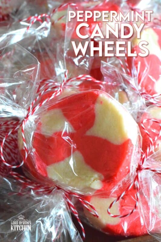 The perfect gift-giving cookie, Peppermint Candy Wheels are individually wrapped in cellophane and tied with a festive string. They may look impressive and maybe even tedious and time consuming, but these cookies really couldn't be easier! And besides, whomever you share these with will certainly appreciate the effort! #peppermint #cookies #candies #redandwhite