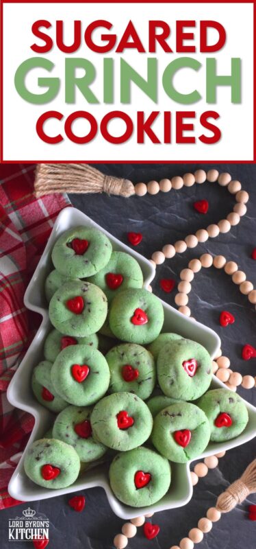 Grinch-themed confections are very popular at Christmastime especially with kids! But, these Sugared Grinch Cookies will appeal to everyone! With a sweet, sugary coating, these thick, puffy cookies are loaded with milk chocolate too! And, despite the fact that the Grinch's heart was small, I've used the biggest red candy heart I could find! #grinch #baking #cookies #christmas #heart