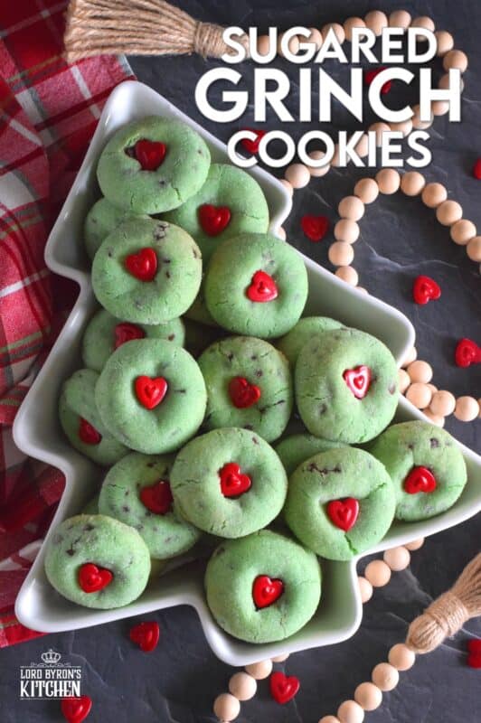Grinch-themed confections are very popular at Christmastime especially with kids! But, these Sugared Grinch Cookies will appeal to everyone! With a sweet, sugary coating, these thick, puffy cookies are loaded with milk chocolate too! And, despite the fact that the Grinch's heart was small, I've used the biggest red candy heart I could find! #grinch #baking #cookies #christmas #heart