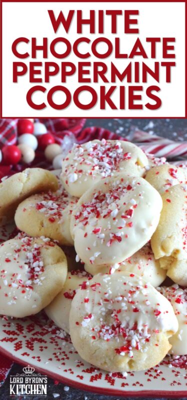 Love the combination of peppermint and chocolate? Who doesn't!? White Chocolate Peppermint Cookies are loaded with peppermint flavour from both the extract and the crushed candy canes. These are not only packed with white chocolate chips, but they're dipped in melted white chocolate too and topped with more crushed candy canes for good measure! #whitechocolate #peppermint #candycane