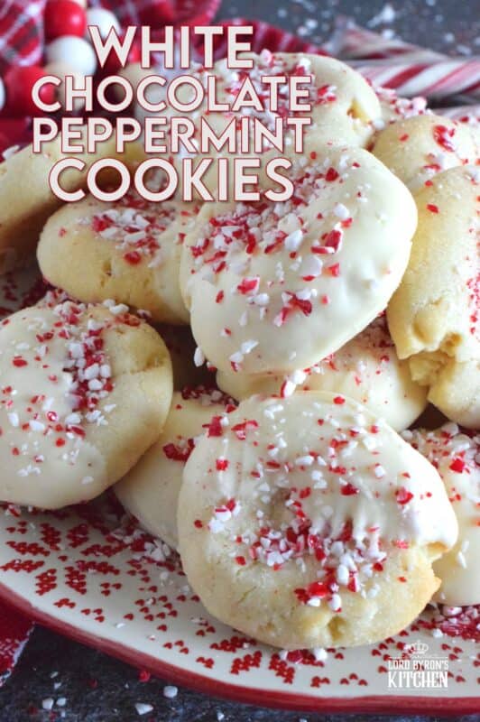 Love the combination of peppermint and chocolate? Who doesn't!? White Chocolate Peppermint Cookies are loaded with peppermint flavour from both the extract and the crushed candy canes. These are not only packed with white chocolate chips, but they're dipped in melted white chocolate too and topped with more crushed candy canes for good measure! #whitechocolate #peppermint #candycane