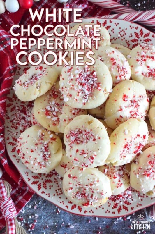 Love the combination of peppermint and chocolate? Who doesn't!? White Chocolate Peppermint Cookies are loaded with peppermint flavour from both the extract and the crushed candy canes. These are not only packed with white chocolate chips, but they're dipped in melted white chocolate too and topped with more crushed candy canes for good measure! #whitechocolate #peppermint #candycane