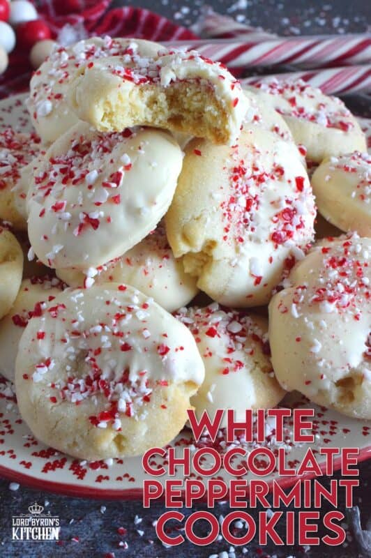 Love the combination of peppermint and chocolate? Who doesn't!? White Chocolate Peppermint Cookies are loaded with peppermint flavour from both the extract and the crushed candy canes. These are not only packed with white chocolate chips, but they're dipped in melted white chocolate too and topped with more crushed candy canes for good measure! #whitechocolate #peppermint #candycane