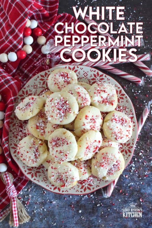 Love the combination of peppermint and chocolate? Who doesn't!? White Chocolate Peppermint Cookies are loaded with peppermint flavour from both the extract and the crushed candy canes. These are not only packed with white chocolate chips, but they're dipped in melted white chocolate too and topped with more crushed candy canes for good measure! #whitechocolate #peppermint #candycane