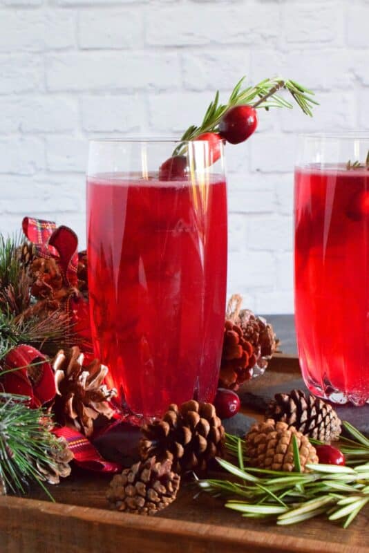 With a bright, citrusy flavour as a result of the lemon juice, cranberry juice, and orange bitters, this sparkling Holiday Cranberry Cocktail is simply delicious and gorgeous! Oh, and it's big too! #cranberry #cocktail #drinks #holiday
