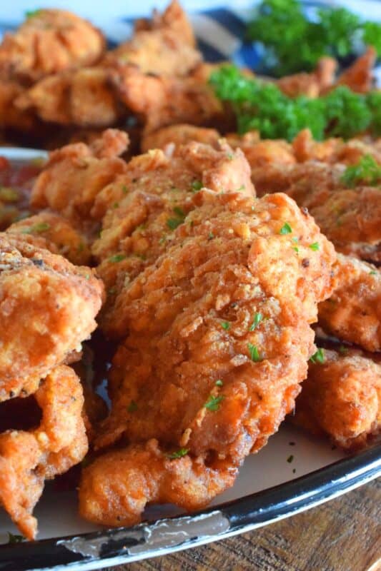 Steak is marinated in buttermilk and seasonings to tenderize and flavour before being double coated in a light batter. The steak is fried until golden and crunchy on the outside but is still moist and tender on the inside. Chicken Fried Steak Fingers have the flavour and crunch of fried chicken but with steak instead! #steakfingers #chickenfried #steak #ribeye #fingers #deepfried