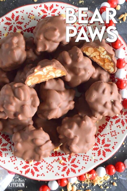 A quick and easy candy with so much delicious flavour! Melted milk chocolate coats a mound of thick and gooey caramel and salted peanut goodness. One bite of these Bear Paws is all it takes to win over just about anyone! #bearpaws #caramel #nuts #nobake