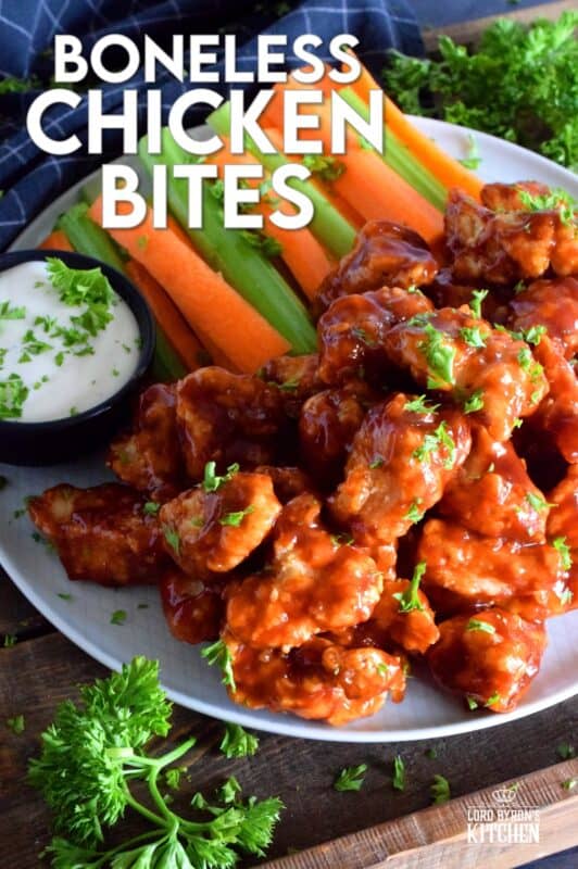 Crispy, fried, battered chicken tossed in your favourite prepared barbecue sauce, Boneless Chicken Bites are a perfect party food. Serve with fresh veggies, dip, and lots of toothpicks. There's no need to get your fingers dirty here! #bonelesschicken #barbecuechicken #BBQ #weeknightrecipes