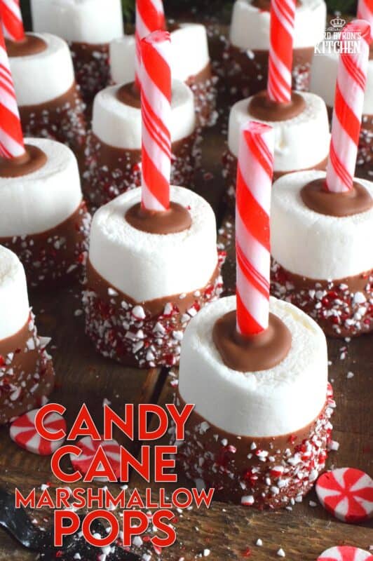 Candy Cane Marshmallow Pops are a delightfully delicious chocolate and peppermint treat prepared with melted milk chocolate, jumbo marshmallows, and crushed cane canes, and peppermint sticks.  Kids will love these, but I don't know any hot chocolate lover who wouldn't marvel over these as well!  These are great for packaging and gifting too! #hotchocolate #peppermint #marshmallows