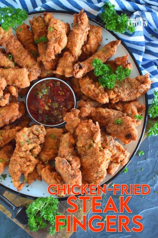Steak is marinated in buttermilk and seasonings to tenderize and flavour before being double coated in a light batter. The steak is fried until golden and crunchy on the outside but is still moist and tender on the inside. Chicken Fried Steak Fingers have the flavour and crunch of fried chicken but with steak instead! #steakfingers #chickenfried #steak #ribeye #fingers #deepfried