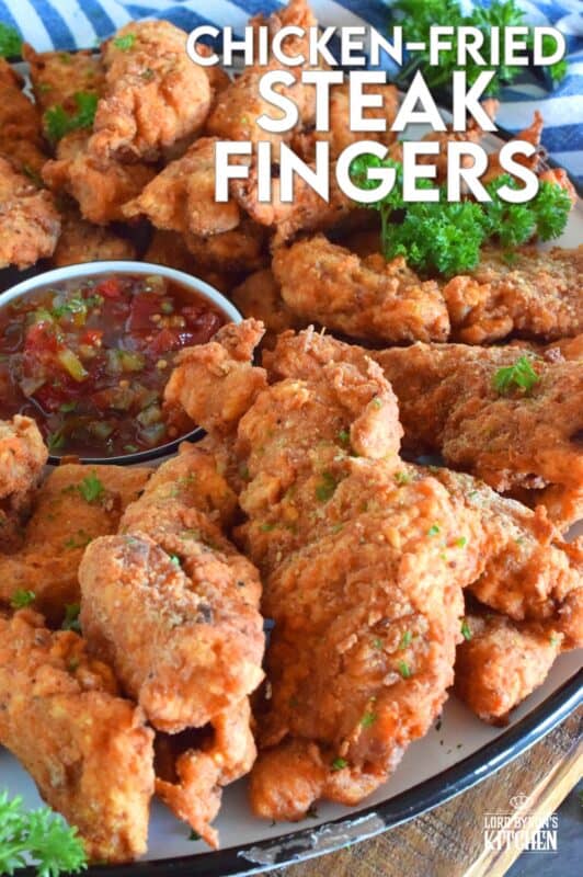Steak is marinated in buttermilk and seasonings to tenderize and flavour before being double coated in a light batter. The steak is fried until golden and crunchy on the outside but is still moist and tender on the inside. Chicken Fried Steak Fingers have the flavour and crunch of fried chicken but with steak instead! #steakfingers #chickenfried #steak #ribeye #fingers #deepfried