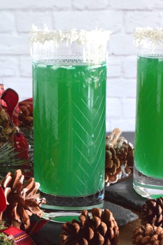 A Jack Frost Cocktail is surprisingly tropical tasting with its pineapple, citrus, and coconut flavours! Top a highball glass with shredded coconut for a more festive-looking drink! #cocktails #drinks #curacao #jackfrost