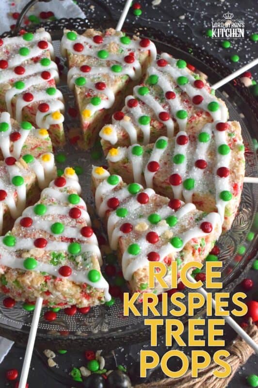 Marshmallow Rice Krispie Treats are prepared in a round cake pan and cut into large wedges.  Insert a lollipop stick and decorate as you wish!  These Festive Christmas Tree Pops are such fun to prepare and super delicious too! #ricekrispie #trees #christmas #pops
