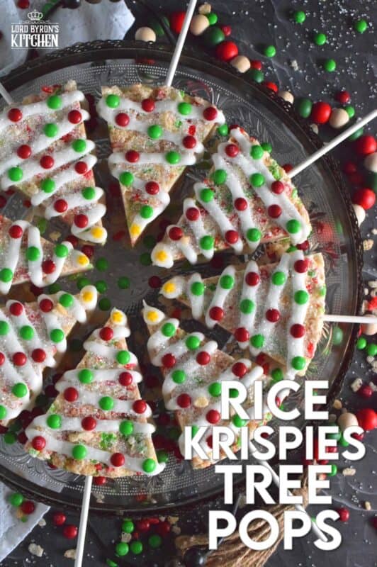 Marshmallow Rice Krispie Treats are prepared in a round cake pan and cut into large wedges.  Insert a lollipop stick and decorate as you wish!  These Festive Christmas Tree Pops are such fun to prepare and super delicious too! #ricekrispie #trees #christmas #pops