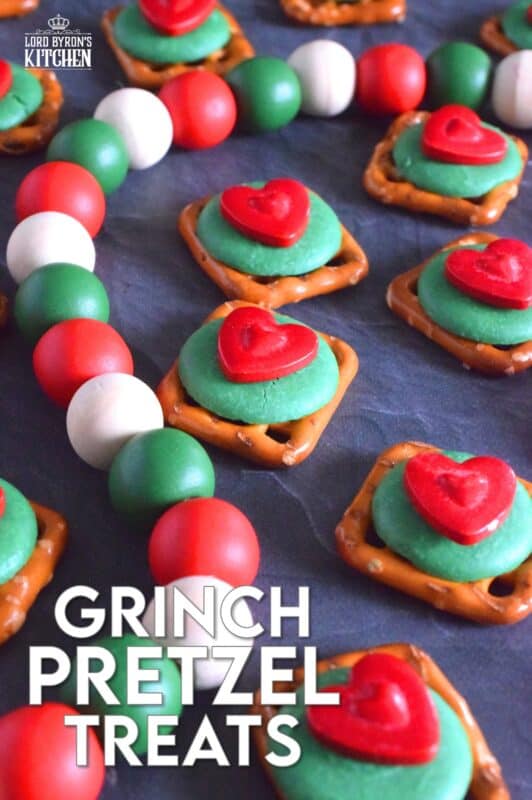 Oftentimes, these types of snacks are prepared with a Hershey's Kiss or a Rolo chocolate candy. But, Grinch Pretzel Treats needed something green and red, so the obvious choice was to top the pretzels with a green candy melt and a big shiny red heart. Aren't they cute!? #grinch #pretzel #treats