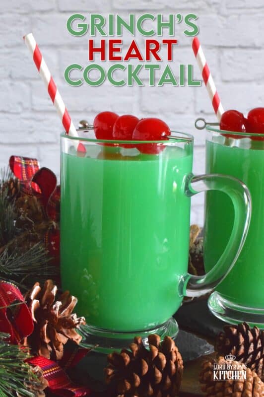 A Grinch's Heart Cocktail would most certainly warm the Grinch's cold heart! Prepared with peach schnapps, rum, orange juice, curacao, and soda, this drink will make you feel all cozy inside! #cocktail #drinks #christmas