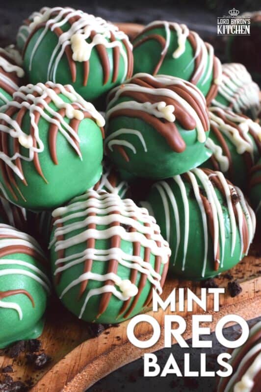 Otherwise known as truffles, these Mint Oreo Balls are prepared with crushed mint-flavoured Oreos and cream cheese. They are dipped in melted green candy melts and drizzled with milk and white melted chocolate. They're bright, beautiful, festive, and delicious! #oreo #truffles #balls #nobake #christmas