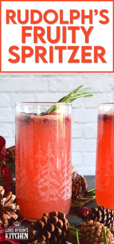 Be sure to serve this cocktail super cold for the best results. Rudolph's Fruity Spritzer has lots of fruit juices, soda, and vodka too! Served in a highball glass, this cocktail is certainly a generous one! #cocktail #drinks #christmas #vodka