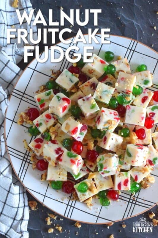 This no-bake fudge recipe is packed full of red and green candied cherries and chopped toasted walnuts. Made with melted white chocolate and canned sweetened condensed milk, Walnut Fruitcake Fudge is super easy and fast to make and tastes delicious too! #fudge #candied #cherries #nobake #fruitcake