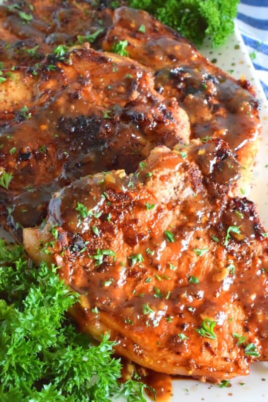 A marinade of sweet and warm ingredients is what makes these pan-fried Honey Mustard Pork Chops so extraordinary! Prepared from start to finish in less than one hour, these are a great weeknight dinner option the whole family will enjoy! #honey #mustard #porkchops #pork #fastfry #familyrecipes #whatsfordinner