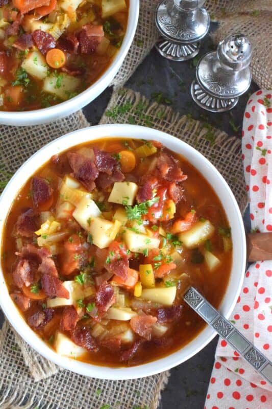 German Potato Soup starts off with bacon, which is a great start to any recipe! Loaded with lots of root vegetables like onions, potatoes, celery root, and carrots, this soup also has leeks, which is a wonderful addition to any soup! Hearty and filling, this soup recipe is certainly a keeper! #soup #german #bacon