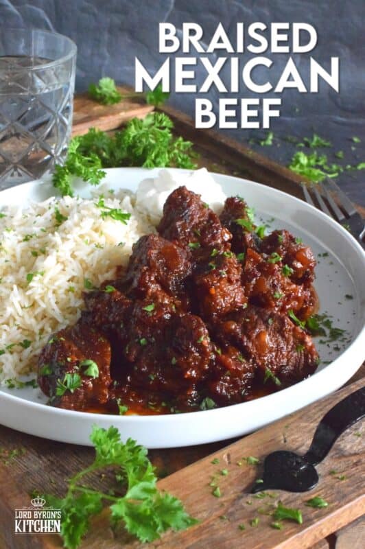 Moist and tender beef is braised in a rich and sweet tomato-based sauce with onion, garlic, chipotle in adobo sauce, and brown sugar. The secret to absolutely delicious Braised Mexican Beef is allowing the meat to cook for hours in a pot with a heavy lid. Braising cannot be rushed and patience is greatly rewarded with just one bite! #mexican #braised #beef #brisket