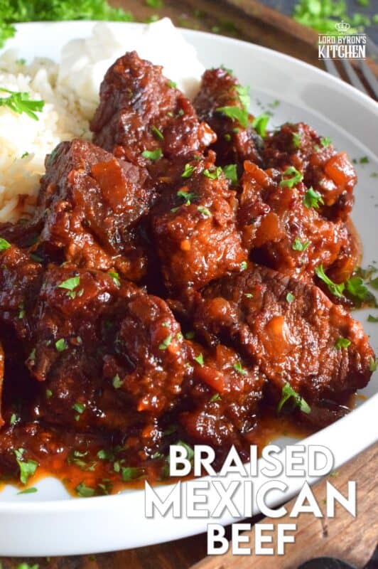 Moist and tender beef is braised in a rich and sweet tomato-based sauce with onion, garlic, chipotle in adobo sauce, and brown sugar. The secret to absolutely delicious Braised Mexican Beef is allowing the meat to cook for hours in a pot with a heavy lid. Braising cannot be rushed and patience is greatly rewarded with just one bite! #mexican #braised #beef #brisket