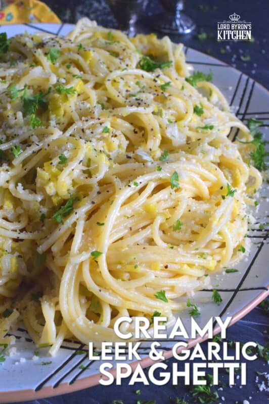 Sweet oniony leeks are paired with garlic, parmesan, and butter in this rustic and delicious Creamy Leek and Garlic Spaghetti. This recipe, although vegetarian, is hearty and filling and can be on your dinner table in thirty minutes or less! #leek #spaghetti #pasta #vegetarian