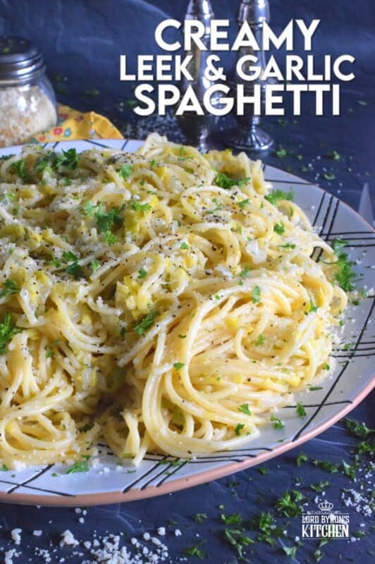 Sweet oniony leeks are paired with garlic, parmesan, and butter in this rustic and delicious Creamy Leek and Garlic Spaghetti. This recipe, although vegetarian, is hearty and filling and can be on your dinner table in thirty minutes or less! #leek #spaghetti #pasta #vegetarian
