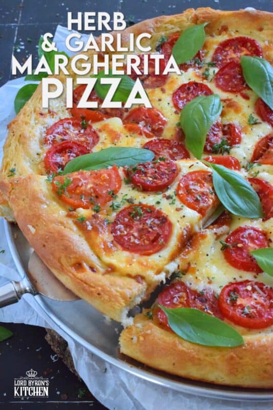 One of the best pizza combinations is the Margherita which is simply prepared with sauce, tomatoes, cheese, and basil. Herb and Garlic Margherita Pizza ups the flavour profile with an easy, savoury, homemade pizza dough filled with dried herbs and spices.  You have to try this! #margherita #pizza #homemade
