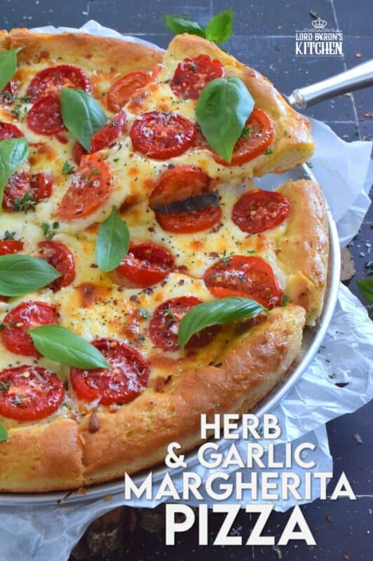 One of the best pizza combinations is the Margherita which is simply prepared with sauce, tomatoes, cheese, and basil. Herb and Garlic Margherita Pizza ups the flavour profile with an easy, savoury, homemade pizza dough filled with dried herbs and spices.  You have to try this! #margherita #pizza #homemade