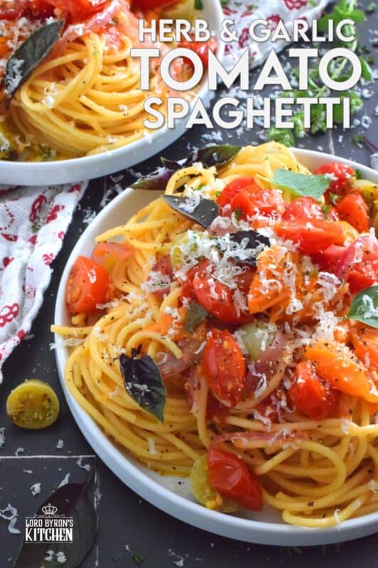 Herb and Garlic Tomato Spaghetti is one of those quick and easy recipes that taste wonderfully delicious! This simple pasta is prepared using fresh herbs like thyme, oregano, and chives.  Cherry tomatoes are blistered with red onions in olive oil to create a sauce. Tossed with perfectly cooked pasta, this dish is a family-friendly meal, but impressive enough for any dinner party! #herbs #pasta #tomatoes #spaghetti