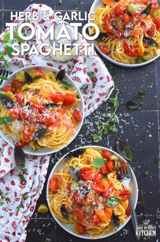 Herb and Garlic Tomato Spaghetti is one of those quick and easy recipes that taste wonderfully delicious! This simple pasta is prepared using fresh herbs like thyme, oregano, and chives.  Cherry tomatoes are blistered with red onions in olive oil to create a sauce. Tossed with perfectly cooked pasta, this dish is a family-friendly meal, but impressive enough for any dinner party! #herbs #pasta #tomatoes #spaghetti