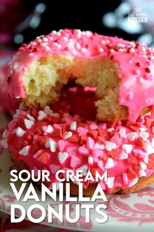 Sour Cream Vanilla Glazed Donuts are baked to perfection in only 10 minutes! They are soft and moist and very cake-like inside. Share these with your favourite valentine or save them all for yourself! #valentines #recipes #pink #donuts #baked