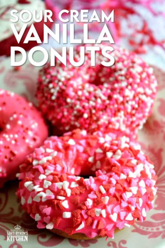 Sour Cream Vanilla Glazed Donuts are baked to perfection in only 10 minutes! They are soft and moist and very cake-like inside. Share these with your favourite valentine or save them all for yourself! #valentines #recipes #pink #donuts #baked