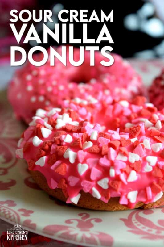Sour Cream Vanilla Glazed Donuts are baked to perfection in only 10 minutes! They are soft and moist and very cake-like inside. Share these with your favourite valentine or save them all for yourself! #valentines #recipes #pink #donuts #baked