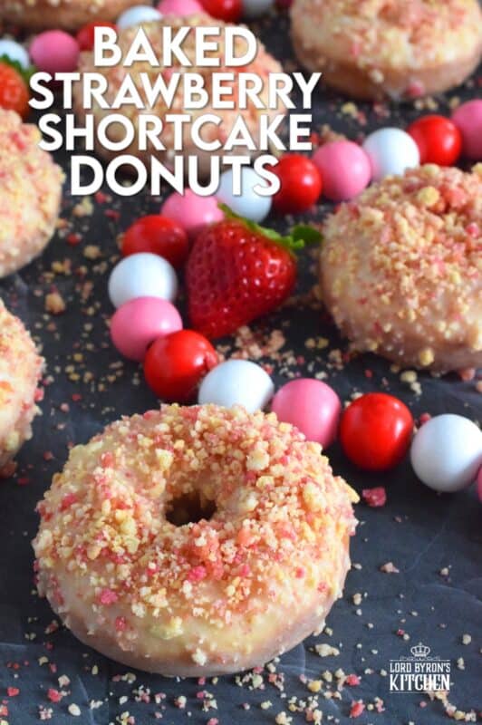 Baked Strawberry Shortcake Donuts are prepared with homemade strawberry shortcake crumbs! Baked to perfection in only 10 minutes, glazed and topped with more shortcake crumbs, these donuts are super soft and moist and very cake-like inside. Share these with your favourite valentine or save them all for yourself! #strawberry #donuts #doughnuts #valentine