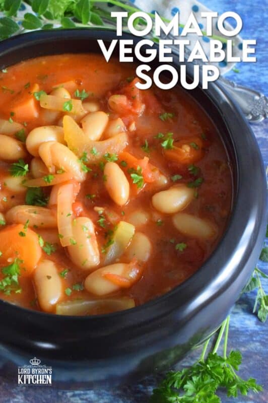 This soup is thick, hearty, and filling! Tomato Vegetable Soup is in fact more like a stew than a soup! It has a dense, homestyle tomato flavour combined with the creaminess of tender white beans, and is paired with lots of fresh and good-for-you vegetables too. Yummy! Sounds good to me! #beans #soup #vegetables #tomato