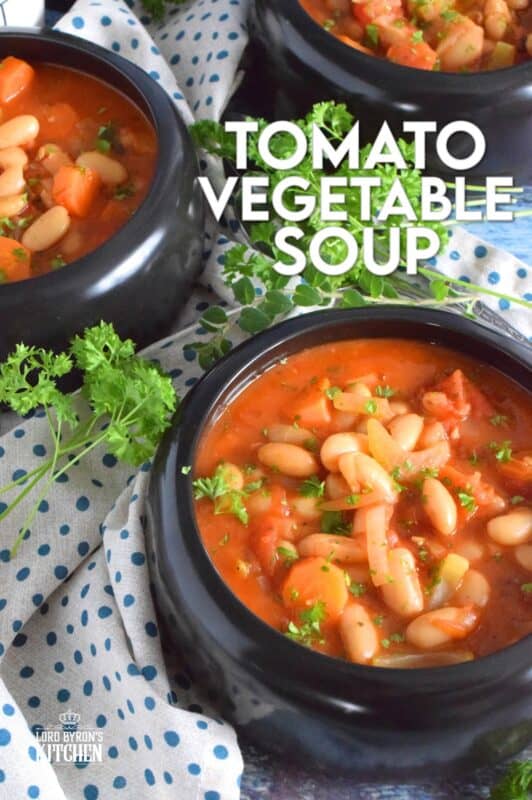 This soup is thick, hearty, and filling! Tomato Vegetable Soup is in fact more like a stew than a soup! It has a dense, homestyle tomato flavour combined with the creaminess of tender white beans, and is paired with lots of fresh and good-for-you vegetables too. Yummy! Sounds good to me! #beans #soup #vegetables #tomato
