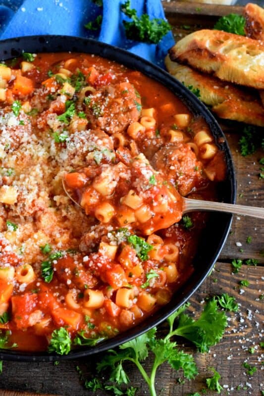 Hearty Meatball Soup is a soup that tastes like a big bowl of homemade pasta and meatballs, but more comforting and warming! Loaded with fresh vegetables and prepared with frozen, store-bought meatballs, this soup is good for you and easy too! #soup #stew #pasta #meatballs #homemade