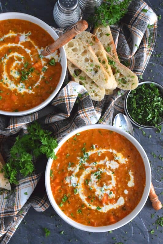 Thick and hearty, Carrot and Red Lentil Soup is good for you too! Completely vegetarian and vegan, this soup is super easy to prepare and is just what is needed to get you through the last stretch of winter. Make a big batch because this soup freezes and reheats very well! #soup #lentils #vegetarian #carrot #vegan
