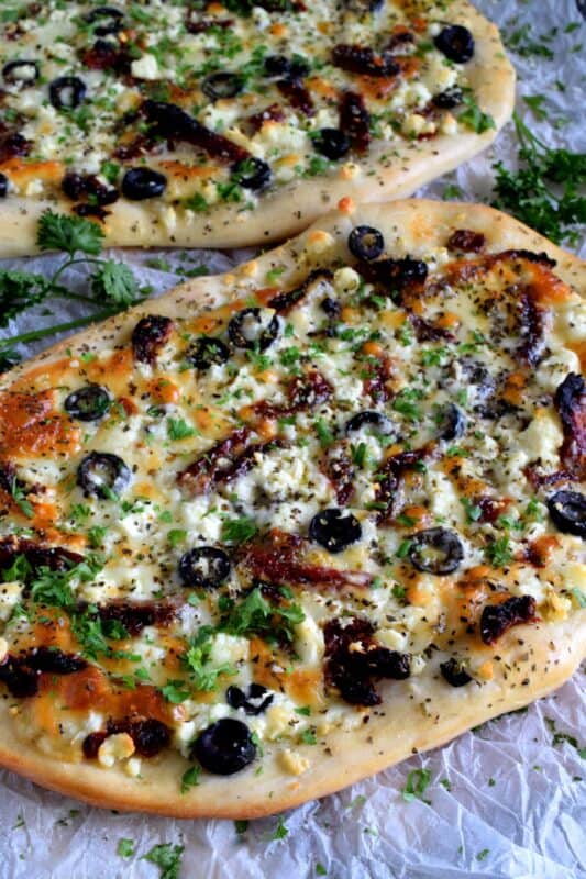 Fast, easy, and delicious Homemade Mediterranean Flatbread-style pizza in less than thirty minutes! Simply change the toppings to suit your preferences! #flatbread #pizza #Mediterranean #homemade #recipe