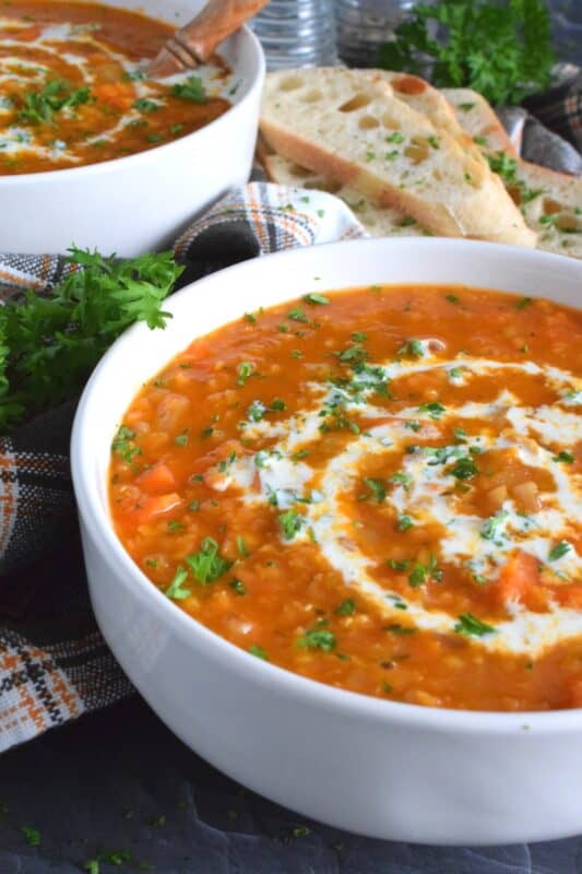 Thick and hearty, Carrot and Red Lentil Soup is good for you too! Completely vegetarian and vegan, this soup is super easy to prepare and is just what is needed to get you through the last stretch of winter. Make a big batch because this soup freezes and reheats very well! #soup #lentils #vegetarian #carrot #vegan